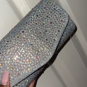 Silver going out bedazzled clutch!